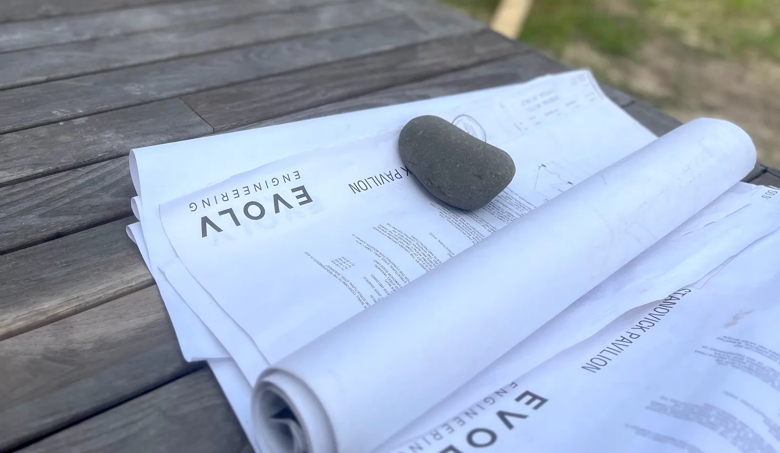 Rolled up plans on a table